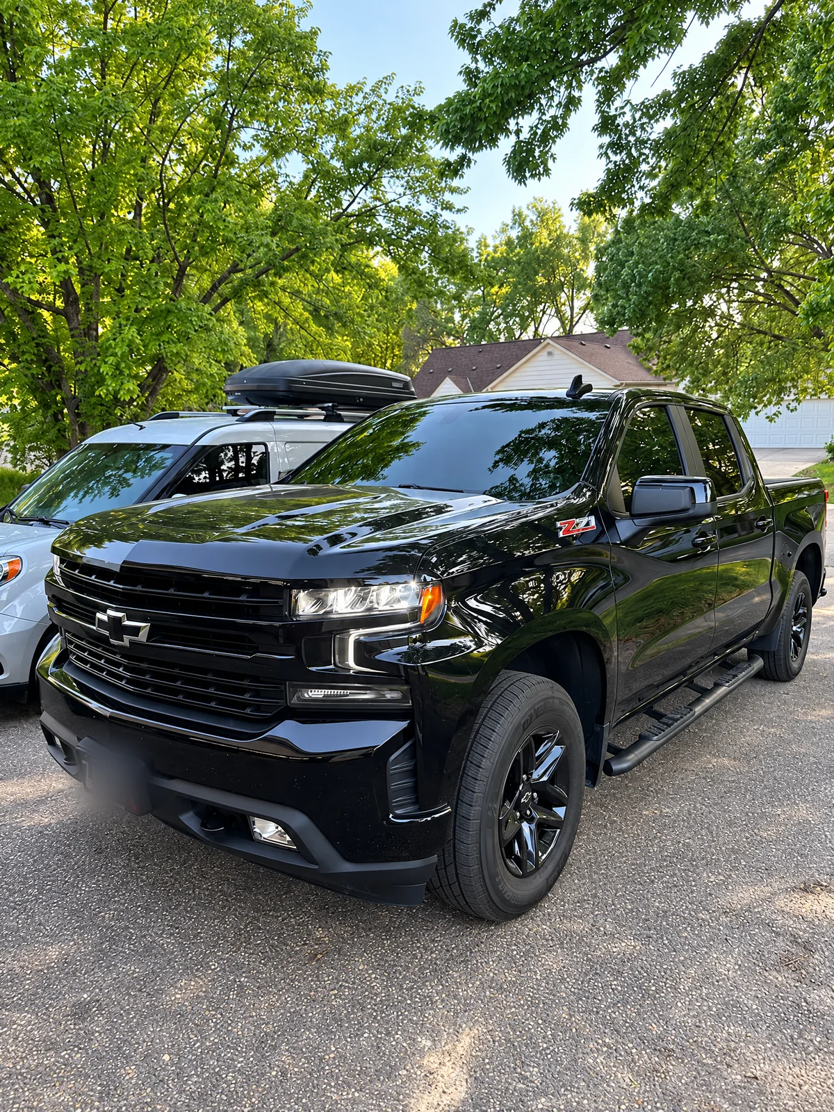 Black Chevrolet Silverado with tinted windows