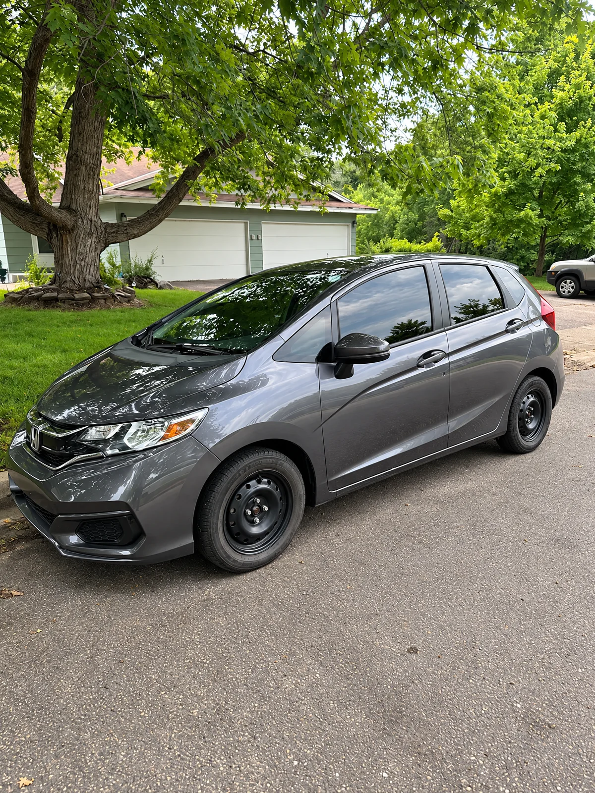 Gray Honda Fit with tinted windows