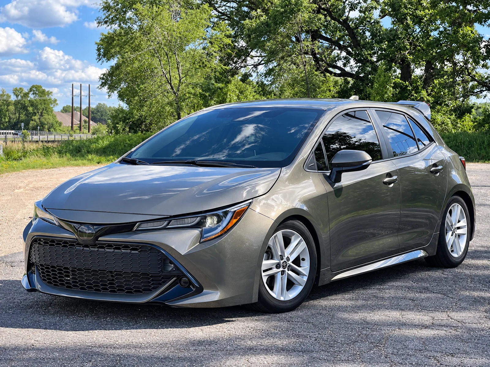 Gray Toyota Corolla hatchback with tinted windows